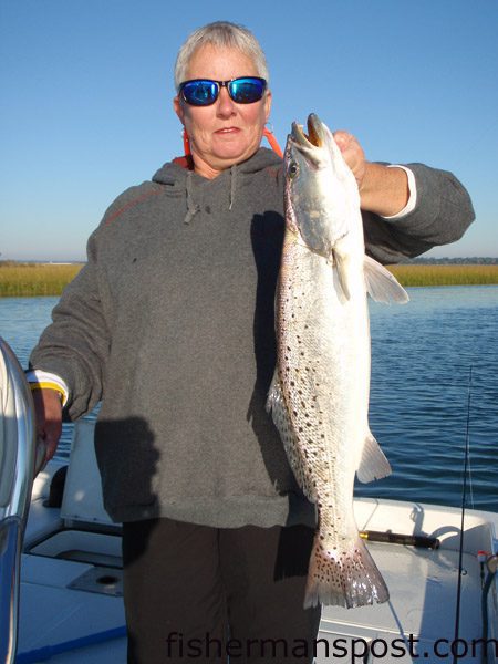Joan Lamb with a 5.5 lb. speckled trout she hooked on her birthday near Swansboro while fishing with Capt. Mike Taylor of Taylor-Made Charters. The gator trout fell for a live shrimp beneath a float.