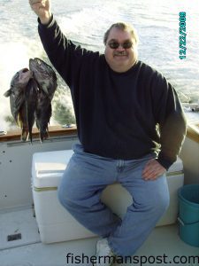 Bob Williams, of Arlington, VA, with a stringer of black sea bass he hooked on squid while fishing off Southport with Capts. Butch and Chris Foster on the "Yeah Right II."