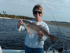 Amber Kasey, of Goldsboro, NC, with a 23" red drum that fell for a D.O.A. shrimp at the Calabash Crossroads.