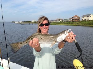 Liz Pitts, of Wells Marine Insurance, with a 3+ lb. speckled trout that bit a live finger mullet near Sneads Ferry while she was fishing with team "Total Liability."
