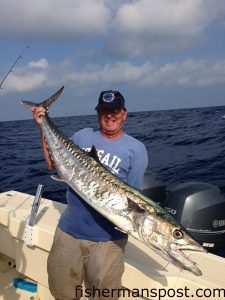 John Early with a healthy king mackerel that bit a live pinfish 22 miles off New Topsail Inlet while he was fishing with his wife Becky.