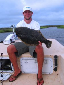 Chris Camp, of Winterville, NC, holds a 23" flounder that bit a Gulp bait near the mouth of the Pamlico River.