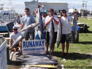 Caleb Batson, Shaun Dunn, Chris and Andrew Carter, and Jason Alberti with 11 wahoo and a dolphin that they hooked while trolling off Hatteras Inlet with Capt. Jay Daniels on the "Runaway."