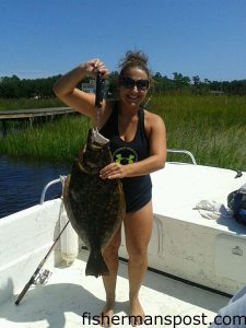 Lauran Skipper, of Wilmington, with a 29" flounder that she hooked on a live finger mullet in the Cape Fear River near Snows Cut.