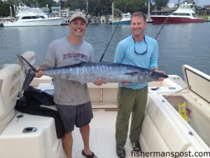Mike Gyure, of Atlanta, GA, and Andrew Oblinger, from Davidson, NC, with a 58 lb. wahoo that they hooked while trolling 62 miles off Masonboro Inlet.