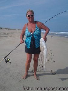 Peggy Byrd, of the Queen Mackerels fishing team, with a 30" red drum she caught and released just south of Oregon Inlet. Photo courtesy of TW's Tackle.