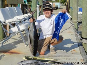 Matt Clarke with dolphin, a yellowfin tuna, and a white marlin release flag--results of an offshore trip out of Oregon Inlet on the "Carolina Style."