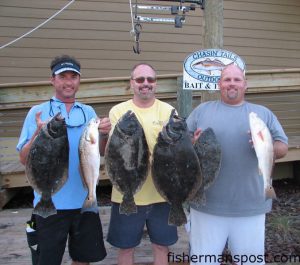David Nelson, Davin Riggan, and Randall Watkins with flounder (the largest pair 8 and 6.7 lbs.) and red drum they hooked on live finger mullet near Morehead City. Weighed in at Chasin' Tails Outdoors.