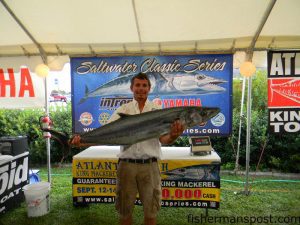 David Logan, of Wrightsville Beach's "Logan's Run" fishing team, with the 41.87 lb. king mackerel that earned he and D. Logan first place and over $31,000 in the Atlantic Beach Saltwater Classic. Their sole king of the day, the fish fell for a naked menhaden on top east of Cape Lookout Shoals.