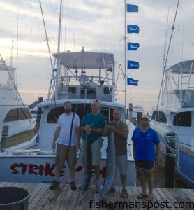 Chelsey Wayne and friends from Raleigh, NC, with a pair of wahoo and five white marlin release flags, the results of an offshore trip with Capt. Lee Collins and mate Bo Davenport on the charterboat "Strike'Em" out of the Oregon Inlet Fishing Center.
