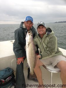 Capt. Ricky Kellum, of Speckled Specialist Charters, and Jason Crowder, of Wilmington, with a 7 lb. speckled trout that fell for a Betts Halo Shad while they were fishing the New River.