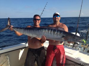 Bobby Houser and Jason Roberts with a 65 lb. wahoo that bit a ballyhoo near the Swansboro Hole.