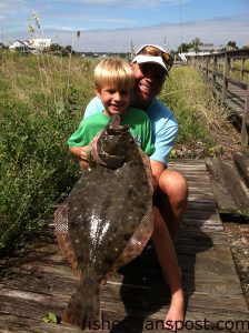 Ben and Sam Hawes with an 11.05 lb. flounder that bit a live finger mullet on a Carolina rig off a dock near Murrells Inlet.