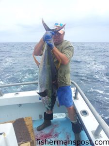 Justin Pickard, of Wilmington, with a 70 lb. yellowfin tuna that bit a ballyhoo under a blue/white Ilander while he was trolling near the 650 line off Oregon Inlet.