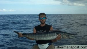 John Martin, of Newport, NC, with a wahoo that struck a blue/white skirted ballyhoo while he was trolling near the Big Rock with Capt. Chris Saunders on the "Moore Toys II."