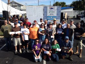 The many winners of the Fisherman’s Post Pleasure Island Surf Fishing Challenge, held October 18-20 along the length of the island, pose  for a group shot with their checks and plaques following the awards ceremony.