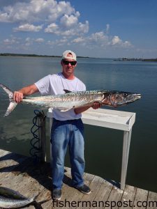 Billy Parkin, of Swansboro, with a citation 33 lb. king mackerel he hooked on a live mullet while fishing off Bogue Inlet on the "Fur-Load."