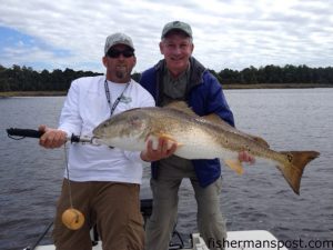 Capt. Jon Huff, of Circle H Charters, and Stan Pigman, from Virginia, with a 43" red drum that bit a Gulp jerkshad in the Cape Fear River.