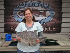 Rachel Jones, of Pittsboro, NC, with a 7.33 lb. triggerfish she caught while bottom fishing near the Big Rock. Weighed in at Chasin' Tails Outdoors.