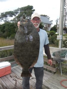 David Derrick, of Oak Island, with a 9.5 lb. flounder that struck a live bait near Southport while he was fishing with Capt. Greer Hughes of Cool Runnings Charters.