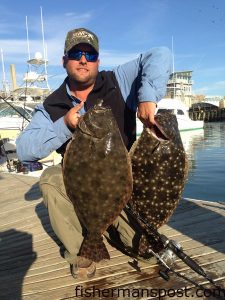 Jason Gregory, of Kernersville, NC, with 8.25 and 7.33 lb. flounder that bit live baits near Masonboro Inlet while he was fishing on the "Spoils of War."