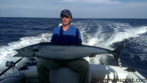 Tracey McCarter, of High Point, NC, with a 65 lb. wahoo that bit a Ballyhood Express high-speed lure at 15 knots while McCarter was trolling off Wrightsville Beach with Matt Huff on the "Total Chaos."