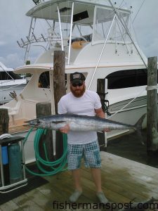 Kevin Collins with a wahoo he hooked while trolling off Oregon Inlet on a recent trip with Capt. Lee Collins and mate Bo Davenport on the charterboat "Strike'Em" out of Oregon Inlet Fishing Center.