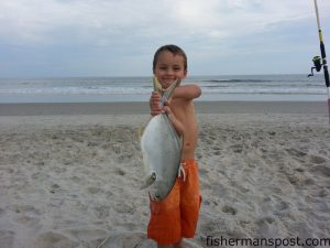 Kyle Cartrette, of Leland, NC, with a citation 3 lb., 3 oz. pompano that bit shrimp in the surf at the north end of Carolina Beach.