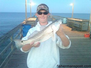 Jake Worthington, of Camden, NC, with a puppy drum he hooked off Avalon Pier.