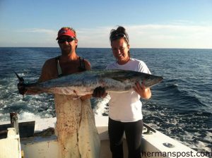 Tim Hagerich and Krista Stumbers, of Hatteras, with a 40 lb. king mackerel that bit a live menahden off Hatteras Inlet while they were fishing with Capt. Andy Piland on the "Goodtimes."