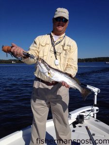 Dennis Barham, of Swansboro, with a 22" speckled trout that bit a MirrOlure MR17 in the White Oak River.