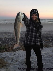 Amanda Poole, of Wilmington, with a red drum she hooked on a chunk of mullet while camping on Lea Island.