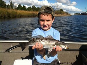Hunter Cain, of Wilmington, with his first speckled trout, a 17" fish that bit a live shrimp in the Cape Fear River near Wilmington.