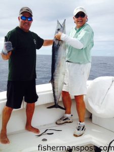 Ned Garber and Larry Spainhour with a 45 lb. wahoo that bit a purple-skirted ballyhoo in 20 fathoms of water inshore of the Steeples. They were fishing with Bob Newell on the "Black Dog."