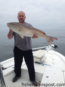 Raymond Hilburn, of Tabor City, NC, with a citation red drum that bit a live mullet near AR-440. He was fishing off Lockwood Folly Inlet with John Maguire.