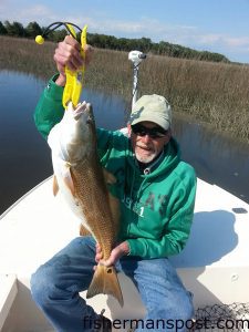 Bob Holtmann, Sr., with a 33" red drum he caught and released in the Elizabeth River near Oak island while fishing with his son. A Gulp shrimp fooled the red.