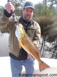 Donnie Alley, of Burlington, NC, with a slot red drum that bit a TTF Hackberry Hustler soft plastic in the New River while he was fishing with Capt. Allen Jernigan of Breadman Ventures. 