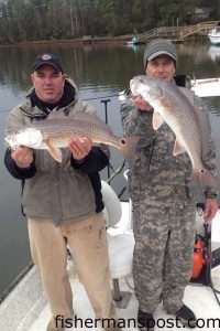 Capt Mark Dickson, of Shallow Minded Inshore Fishing Charters, and Terry Helms with a pair of red drum that bit Gulp Swimming Mullet in the Shallotte River.
