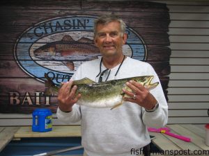 Doug McMullen with the 6.86 lb. speckled trout that earned him first place in the 6th Annual Chasin' Tails Outdoors Speckled Trout Challenge along with $2,310, a Dog Island Art reproduction of the fish, and a tackle package. The big speck fell for a Spook, Jr. topwater plug off the Neuse River.