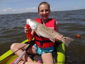 Madison Beaver with her first puppy drum. The pup fell for a Gulp bait beneath a popping cork while she was kayak fishing the Pamlico Sound with her stepfather, Rob Alderman of Outer Banks Kayak Fishing.