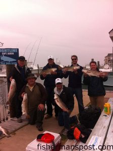 The Walter party of northern VA, with a limit of puppy drum they hooked while casting gold spoons in the Pamlico Sound with Capt. Aaron Aaron of Tightline Charters.