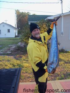 Scott Wilson with a 39.5 lb. wahoo that bit a blue/white softhead lure at the Yellowfin Hole while he was trolling on the "Pura Vida."