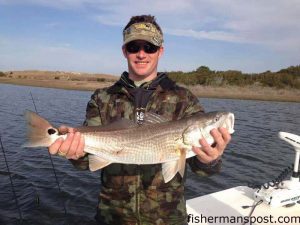 Frasier Bullington, of Ocean Isle Beach, with a 26" red drum that struck a Zoom Fluke soft plastic scented with Pro-Cure Super Gel in a bay behind Emerald Isle. He was fishing with Capt. Rob Koraly of Sandbar Safari Charters.