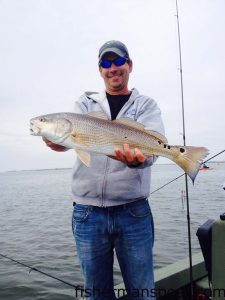 Capt. David Peck, of Skiligal Sportfishing, with an upper-slot puppy drum he hooked on a Gulp bait beneath a popping cork while fishing the sound near Oregon Inlet Fishing Center.