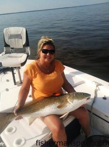Sharon Dowdy with a 42" red drum that bit a D.O.A. Deadly Combo rig while she was fishing for speckled trout and puppy drum in the lower Neuse River with Capt. Dave Stewart of Knee Deep Custom Charters.