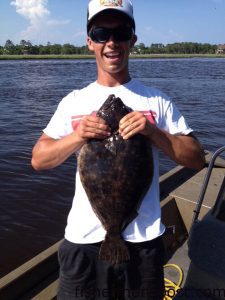 Tyler Chabot, of Kure Beach, with a 6 lb. flounder that bit a soft plastic bait in Snow's Cut. Weighed in at Kure Pier.