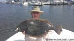 Snead Carey, of Roxboro, NC, with a fat flounder that bit a Gulp bait off the ICW while he was fishing with Capt. Wayne Crisco of Last Resort Charters.