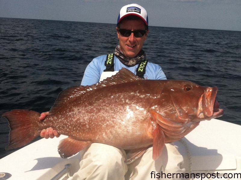 Matthew Stokely, of Wilmington, with a 27 lb. red grouper that bit a squid/cigar minnow combo at some bottom structure in 130′ of water off Wrightsville Beach while he was fishing with Capt. Arlen Ash of Ultimate Reaction Charters.