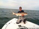 Capt. Ryan Rayfield, of Conjured Up Fishing Charters, with a citation-class red drum that bit a 2 oz. bucktail jig a few miles off Oak Island. The fish was released after the photo.