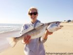 Anne Lusk with one of many large speckled trout she and her husband Matt hooked on soft plastic baits in the Nags Head surf.